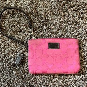 Pink Coach wristlet.
